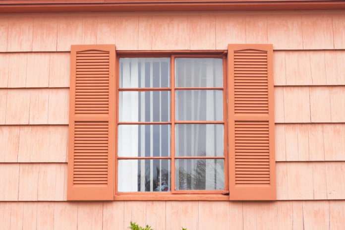 Vintage window with orange tone wall model jendela minimalis