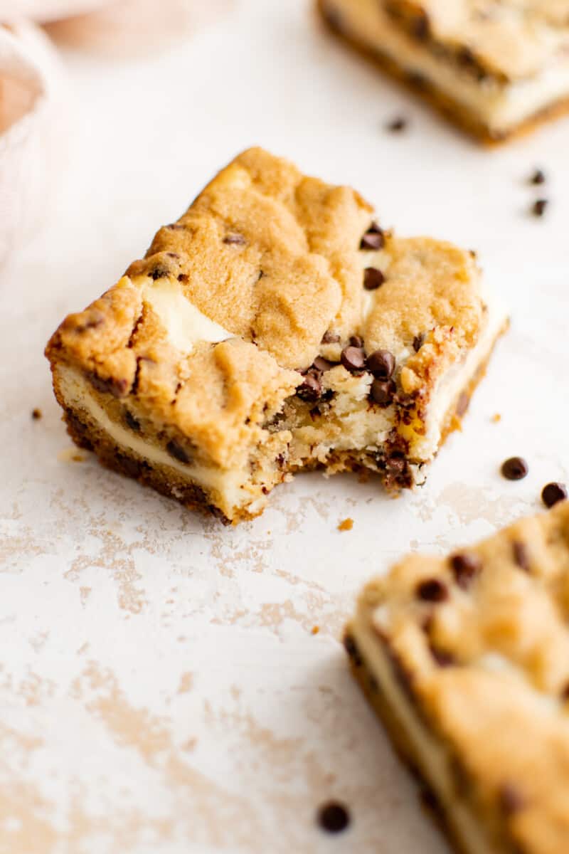 chocolate chip cheesecake bar with a bite taken out